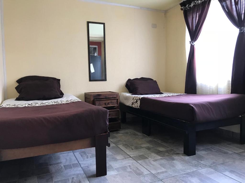 Номер (Односпальная кровать в общем номере для мужчин и женщин) гостевого дома Hostal Luxury Tlatlauquitepec, Тлатлаукитепек