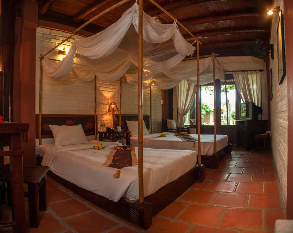 Двухместный (Улучшенный двухместный номер с 1 кроватью или 2 отдельными кроватями и видом на сад) курортного отеля Van Chai Resort, Тхань Хоа