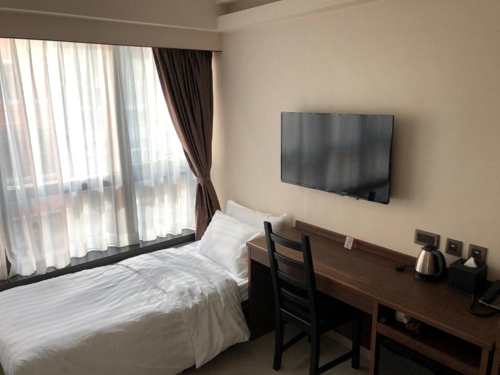 Трехместный (Двухместный номер с 2 отдельными кроватями и дополнительной кроватью) отеля WE Hotel, Гонконг (город)