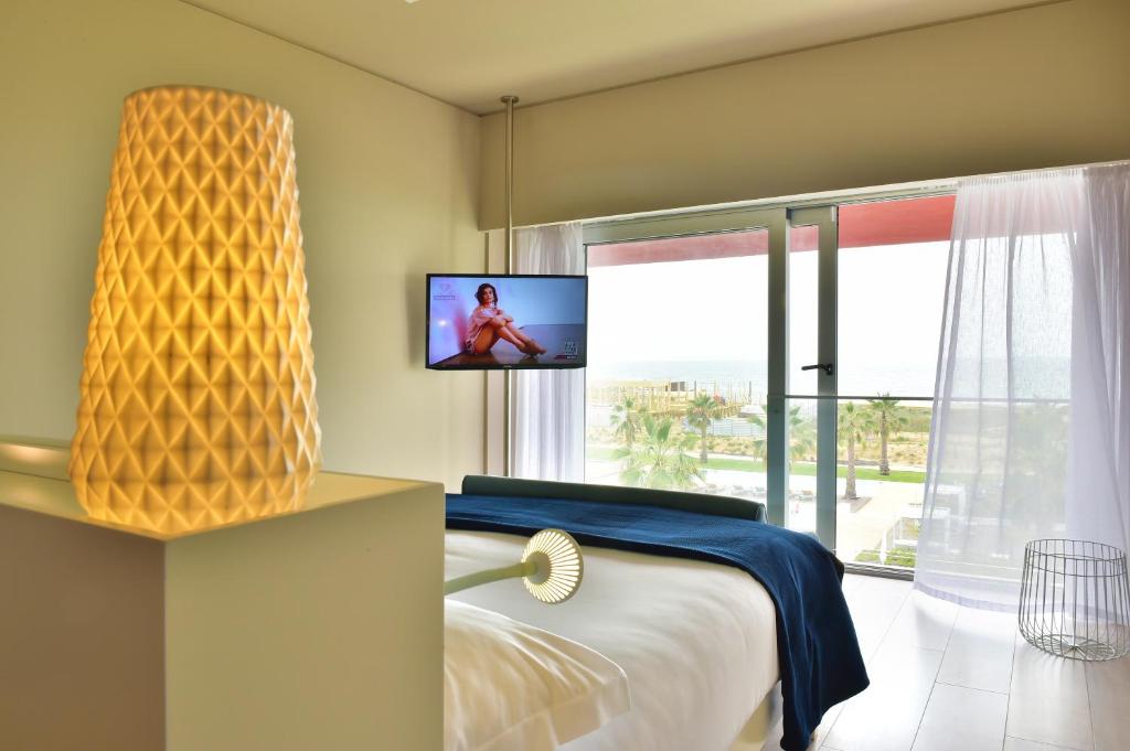 Двухместный (Двухместный номер Делюкс с 1 кроватью или 2 отдельными кроватями и видом на море) отеля Pestana Alvor South Beach Premium Suite Hotel, Алвор