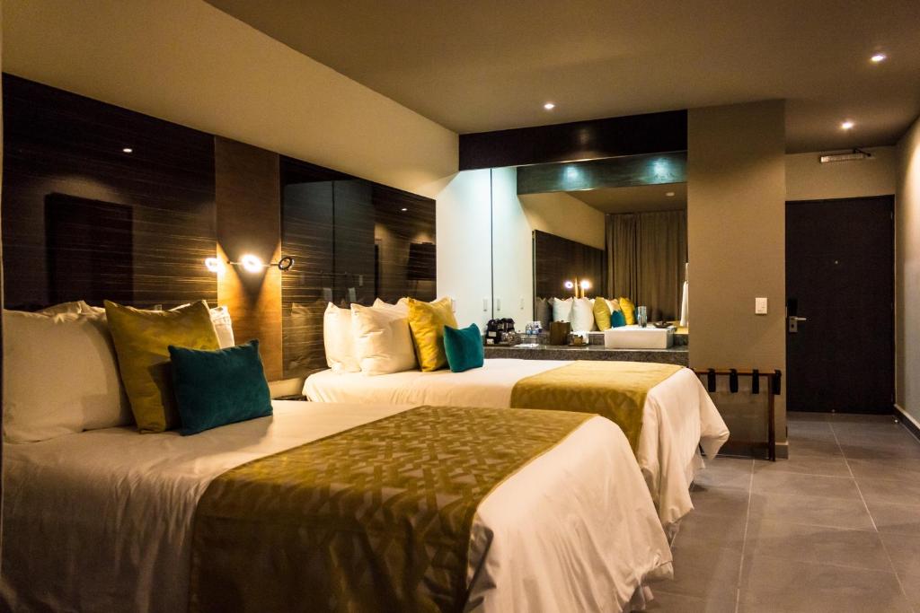 Двухместный (Двухместный номер Делюкс с 1 кроватью) отеля Kabah Boutique Hotel, Канкун