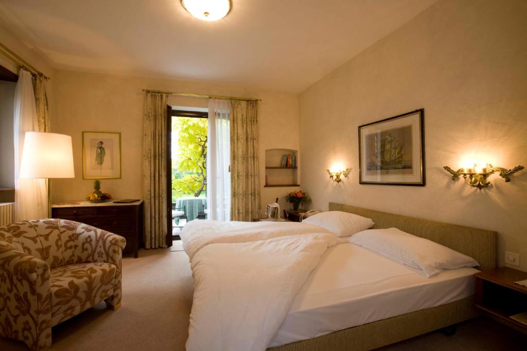 Двухместный (Улучшенный двухместный номер с 1 кроватью) отеля Romantik Hotel Castello Seeschloss, Аскона