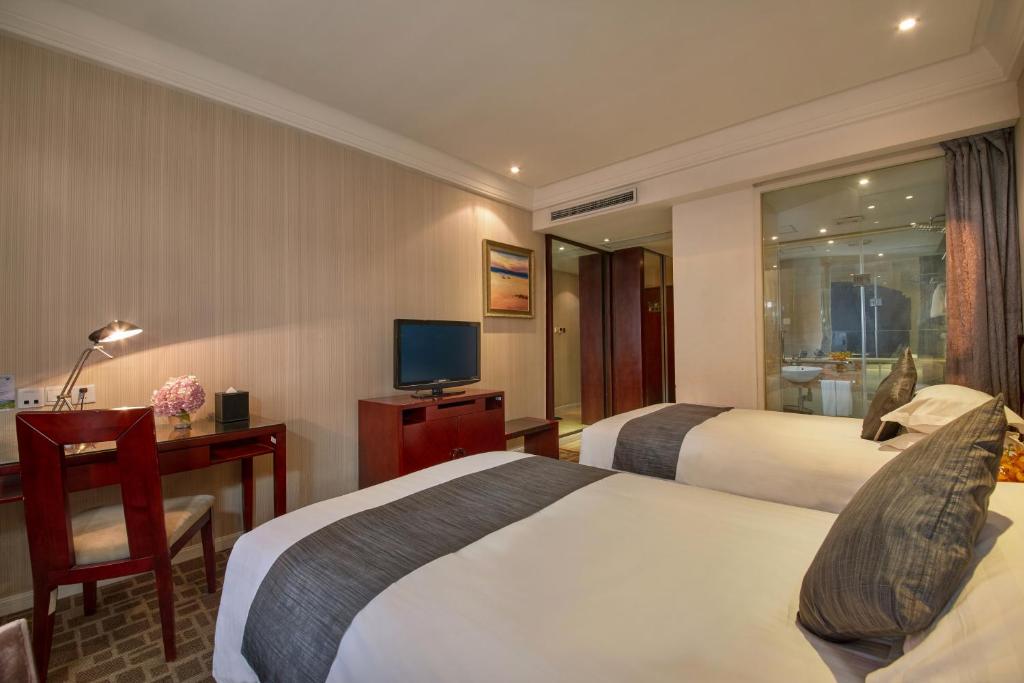 Двухместный (Двухместный номер бизнес-класса с 2 отдельными кроватями) отеля New Century Manju Hotel·Shanghai Railway Station, Шанхай