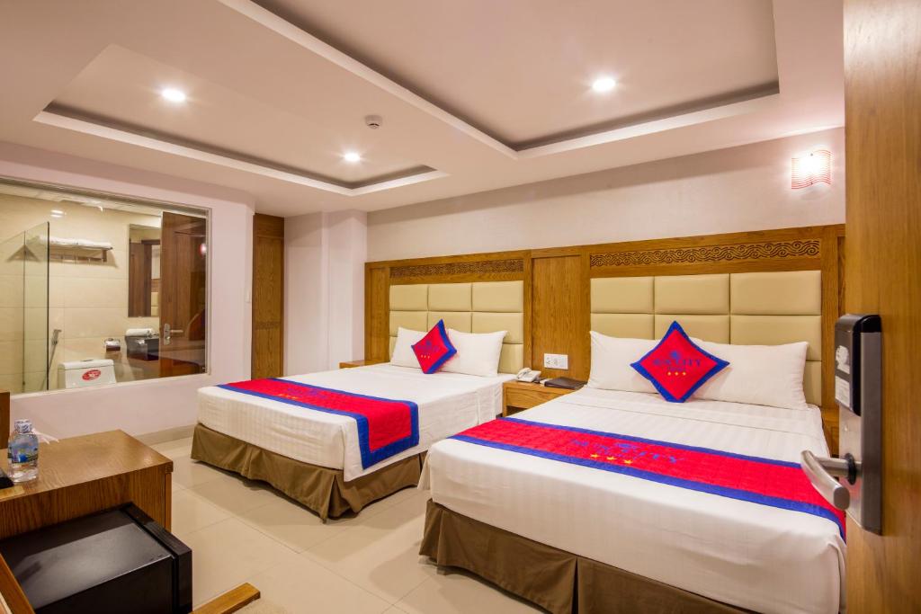 Двухместный (Улучшенный двухместный номер с 2 отдельными кроватями) отеля Sun City Hotel, Нячанг