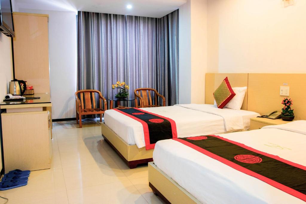 Двухместный (Двухместный номер Делюкс с 1 кроватью или 2 отдельными кроватями, вид на город) отеля Le Duong Hotel, Нячанг