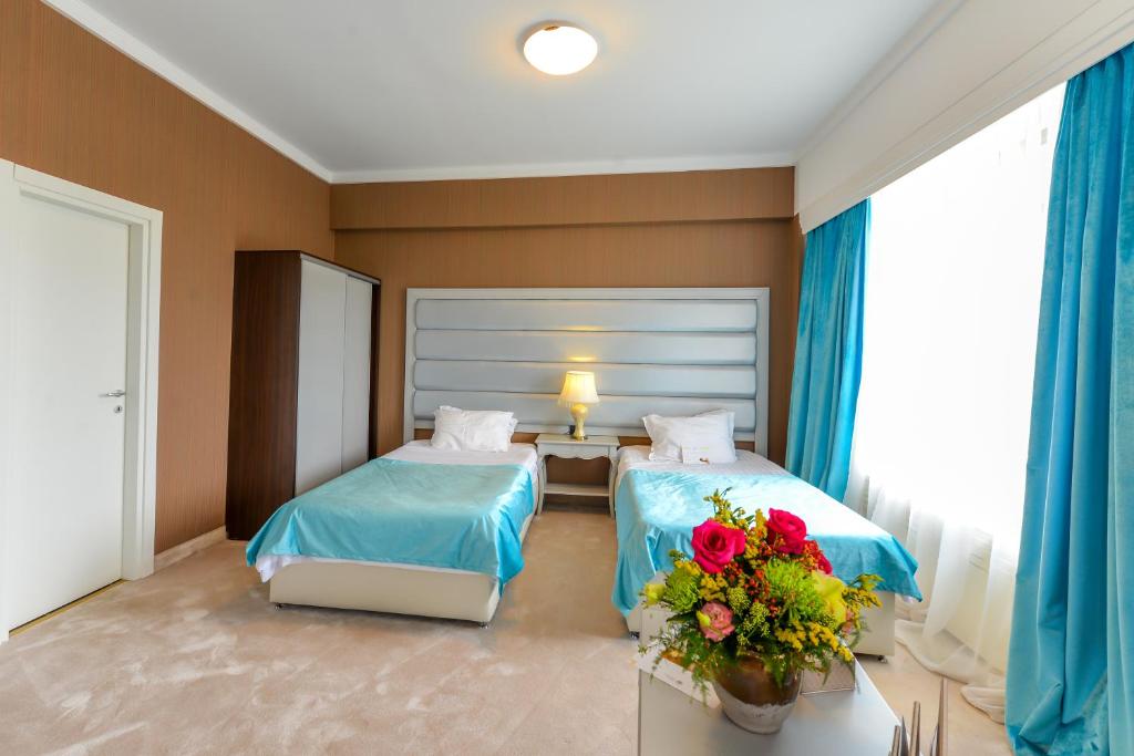 Двухместный (Улучшенный двухместный номер с 2 отдельными кроватями) отеля Phoenicia Grand Hotel, Бухарест