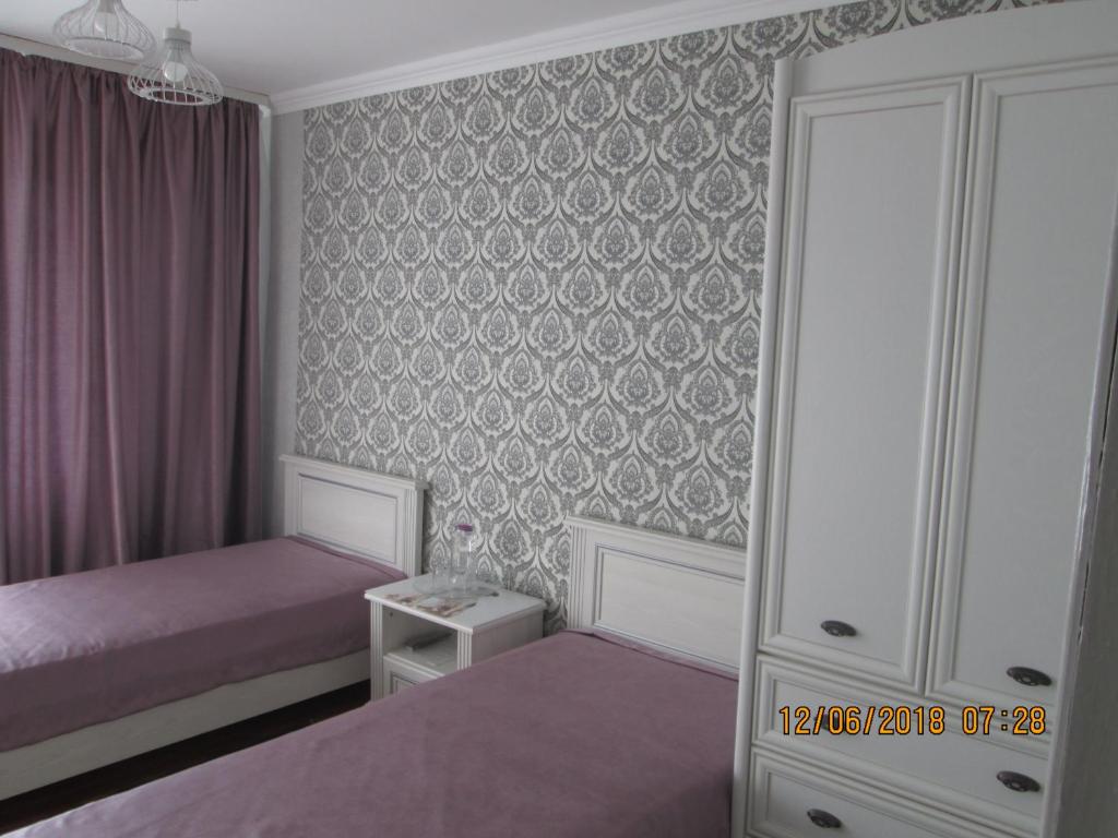Двухместный (Двухместный номер с 2 отдельными кроватями и собственной ванной комнатой) отеля Днестровский сад, Дубоссары