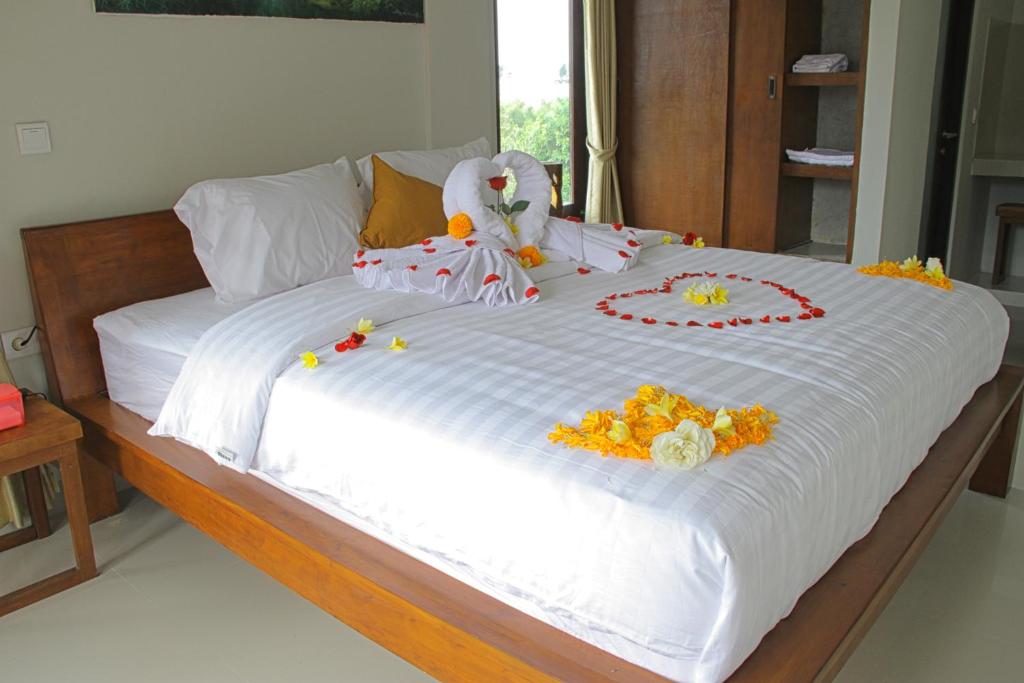 Двухместный (Двухместный номер Делюкс с 1 кроватью и балконом), Umah Tikari Guesthouse