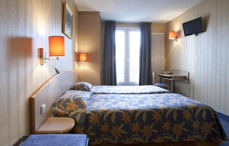 Двухместный (Стандартный двухместный номер с 2 отдельными кроватями) отеля Hôtel Transcontinental, Париж