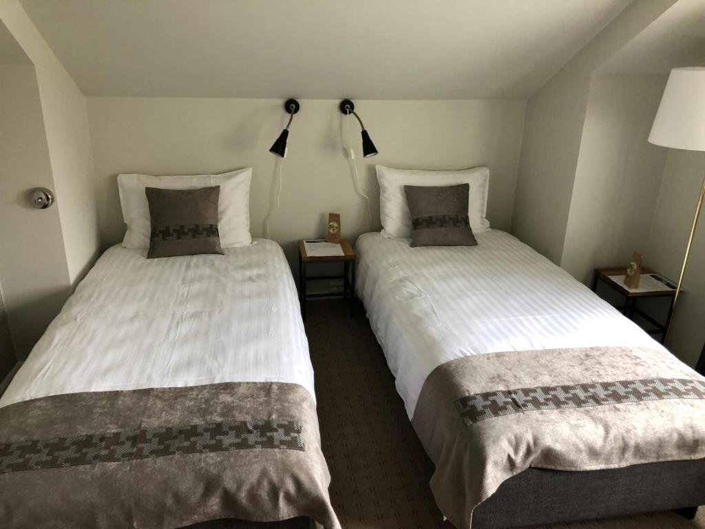 Двухместный (Улучшенный двухместный номер с 2 отдельными кроватями) отеля Arctic Hotel Nordkapp, Хоннингсвог