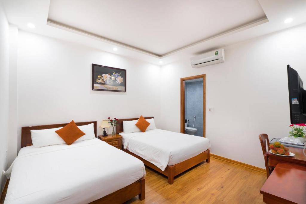 Четырехместный (Четырехместный номер с 2 двуспальными кроватями) семейного отеля Lantern Riverside Hoi An, Хойан