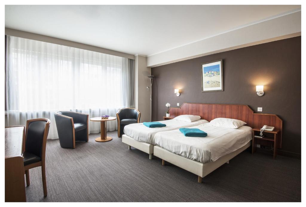 Двухместный (Улучшенный двухместный номер с 1 кроватью или 2 отдельными кроватями) отеля Hotel Ter Streep, Остенде