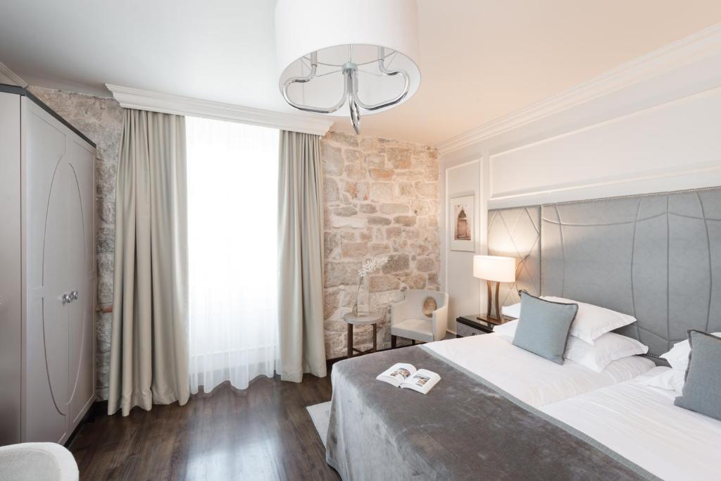 Двухместный (Улучшенный двухместный номер с 2 отдельными кроватями) отеля Bastion Heritage Hotel - Relais & Châteaux, Задар