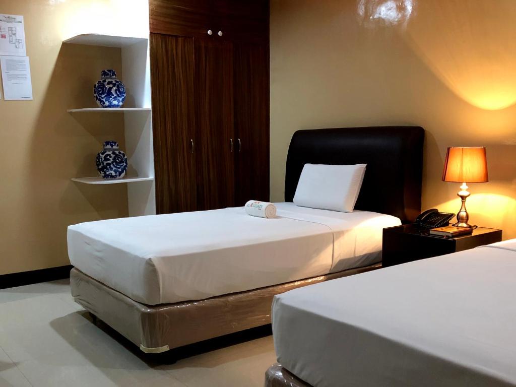 Двухместный (Двухместный номер Делюкс с 2 отдельными кроватями) отеля Al-Raddadi Suites, Давао