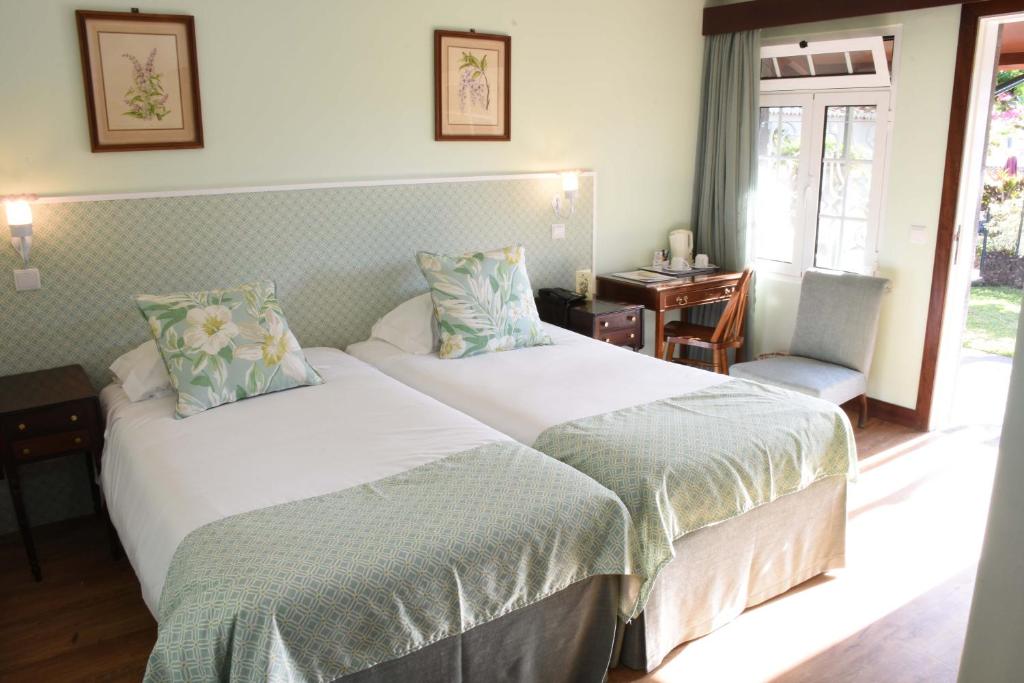 Двухместный (Двухместный номер с 2 отдельными кроватями, террасой и видом на сад) отеля Quinta Da Penha De Franca, Фуншал