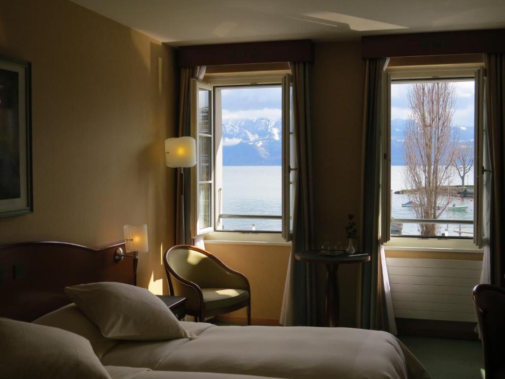 Двухместный (Двухместный номер с 2 отдельными кроватями и видом на озеро) отеля Hôtel du Port, Лозанна