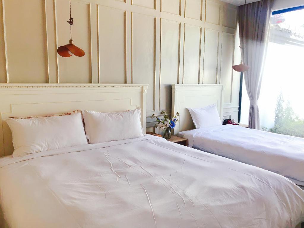 Двухместный (Двухместный номер Делюкс с 2 отдельными кроватями) семейного отеля Youxiake Canal Hotel Hangzhou, Ханчжоу