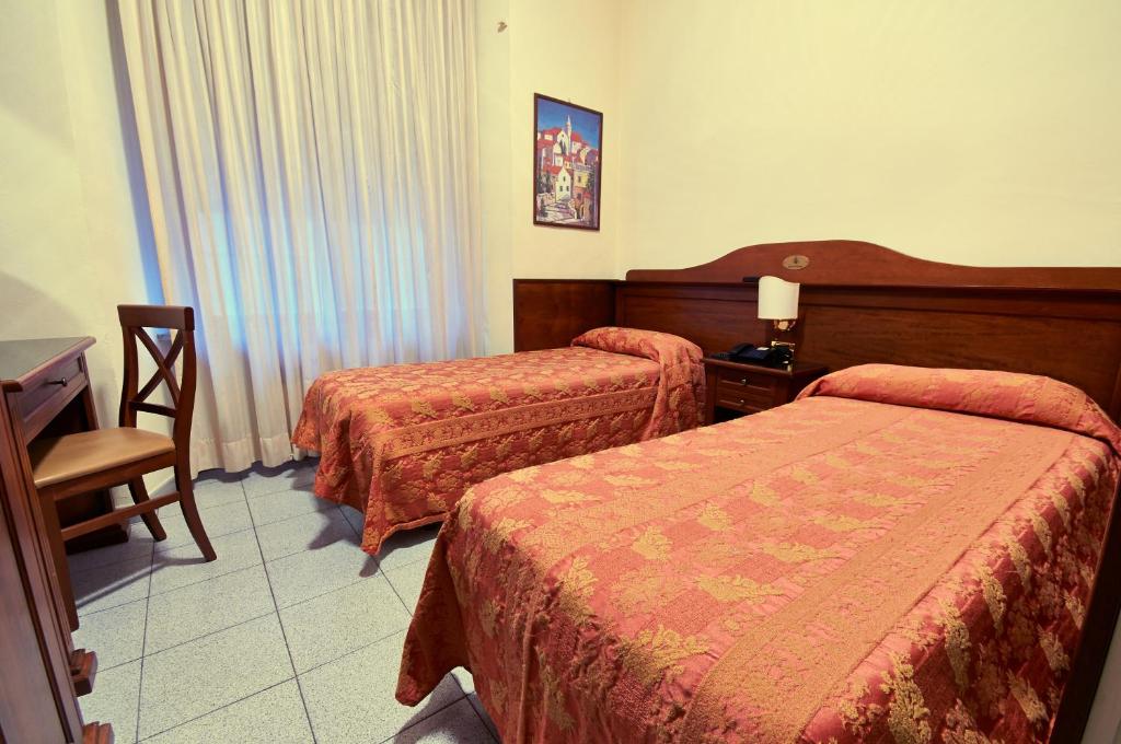 Двухместный (Двухместный номер с 2 отдельными кроватями) отеля Hotel Pavone, Милан