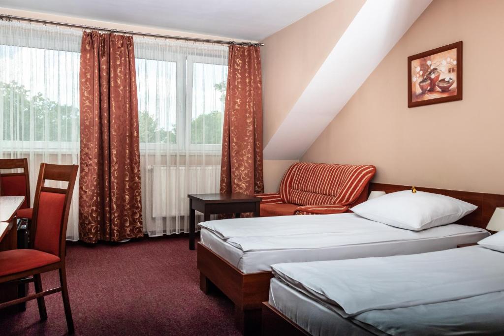Двухместный (Стандартный двухместный номер с 2 отдельными кроватями) апарт-отеля Prima, Пулавы