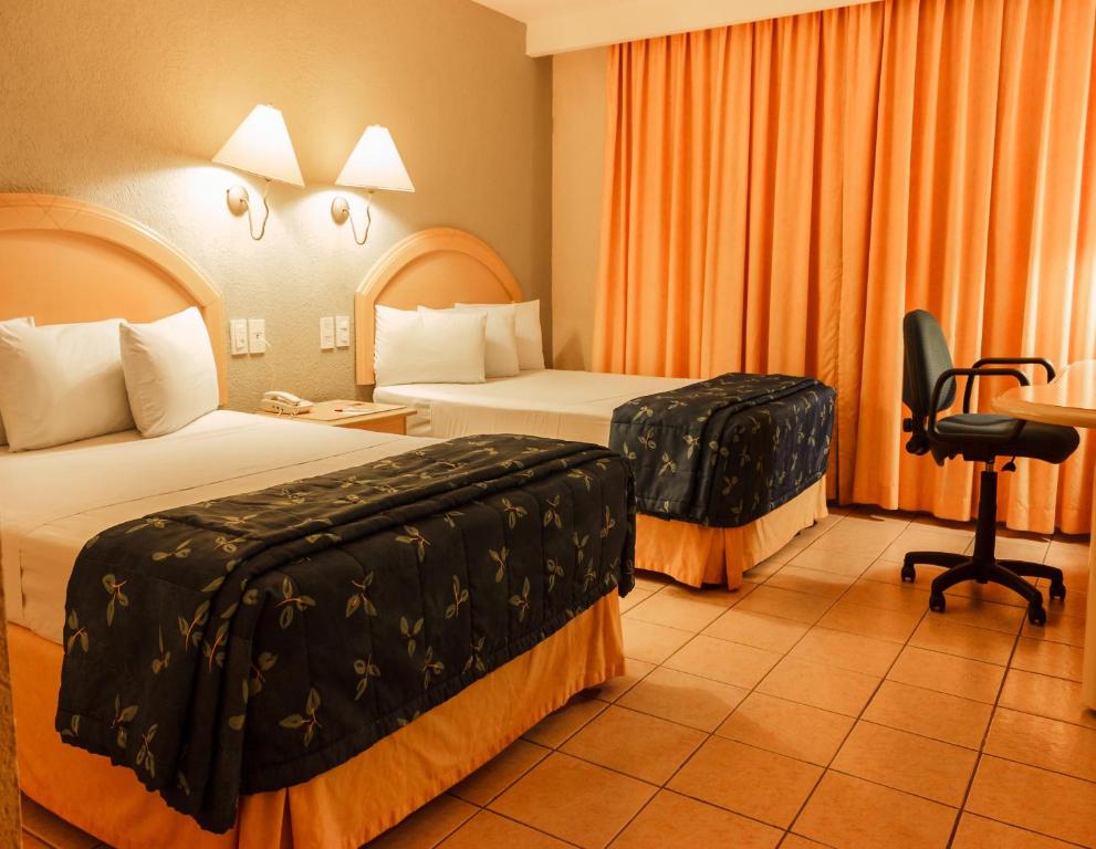 Двухместный (Двухместный номер с 2 двуспальными кроватями - не возвращаемая оплата) отеля Plaza Inn Express, Тапачула