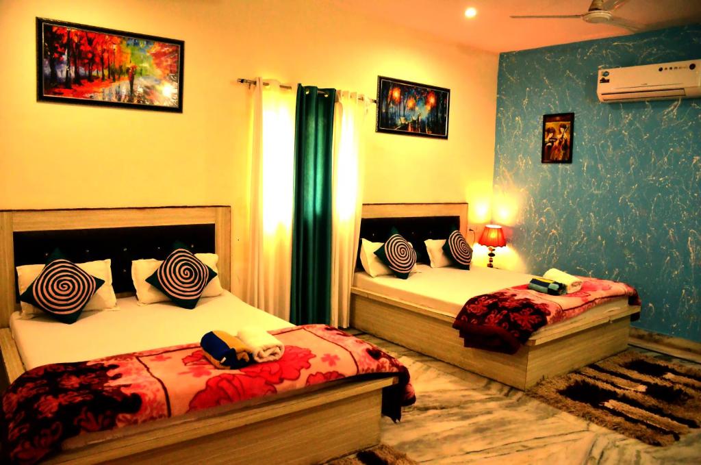 Двухместный (Двухместный номер Делюкс с 1 кроватью или 2 отдельными кроватями) семейного отеля Taj Castle Homestay, Агра