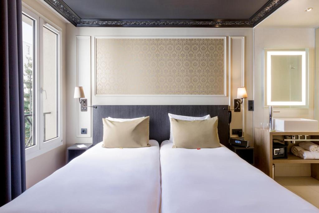 Двухместный (Улучшенный двухместный номер с 2 отдельными кроватями) отеля Best Western Le Montmartre – Saint Pierre, Париж