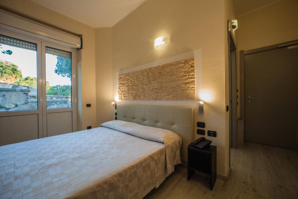 Двухместный (Двухместный номер Делюкс с 1 кроватью или 2 отдельными кроватями) отеля Hotel Ristorante Calamosca, Кальяри