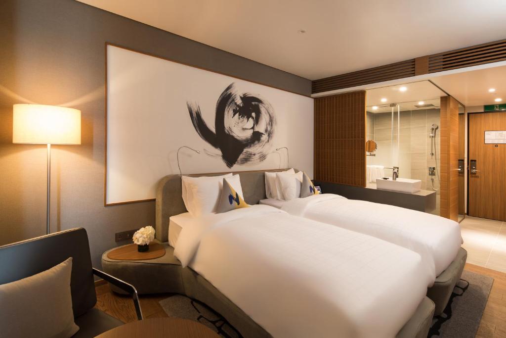 Двухместный (Улучшенный двухместный номер с 2 отдельными кроватями) отеля Novotel Ambassador Seoul Dongdaemun Hotels & Residences, Сеул