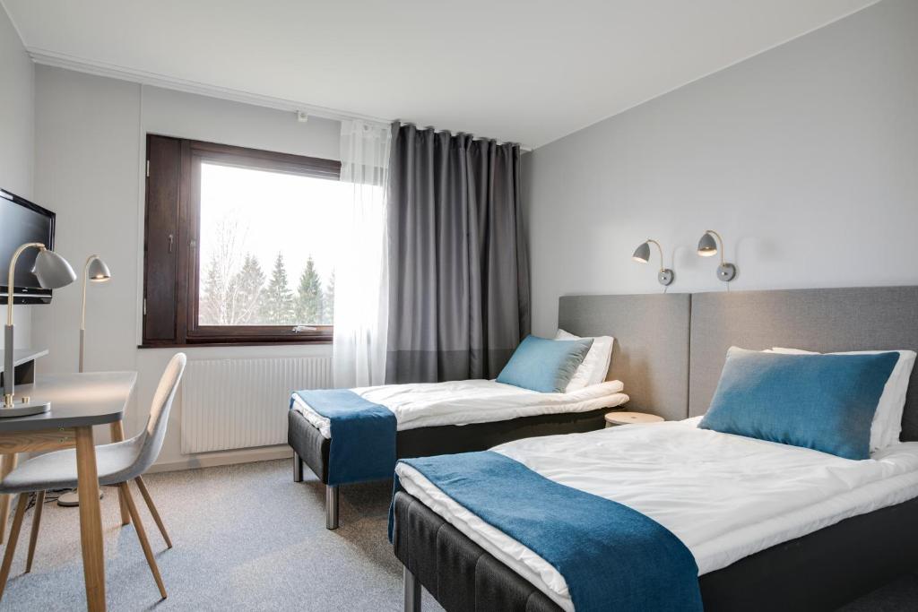 Двухместный (Стандартный двухместный номер с 2 отдельными кроватями) отеля Karlskoga Hotell & Konferens, Эребру