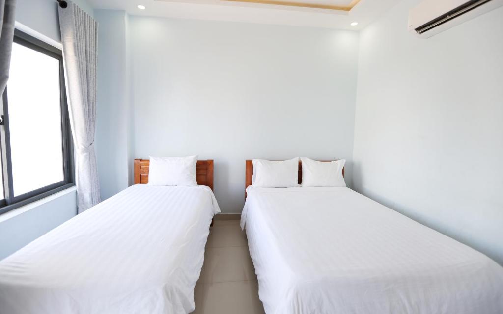 Двухместный (Двухместный номер Делюкс с 2 отдельными кроватями) отеля House 579 Hai Ba Trung, Хойан