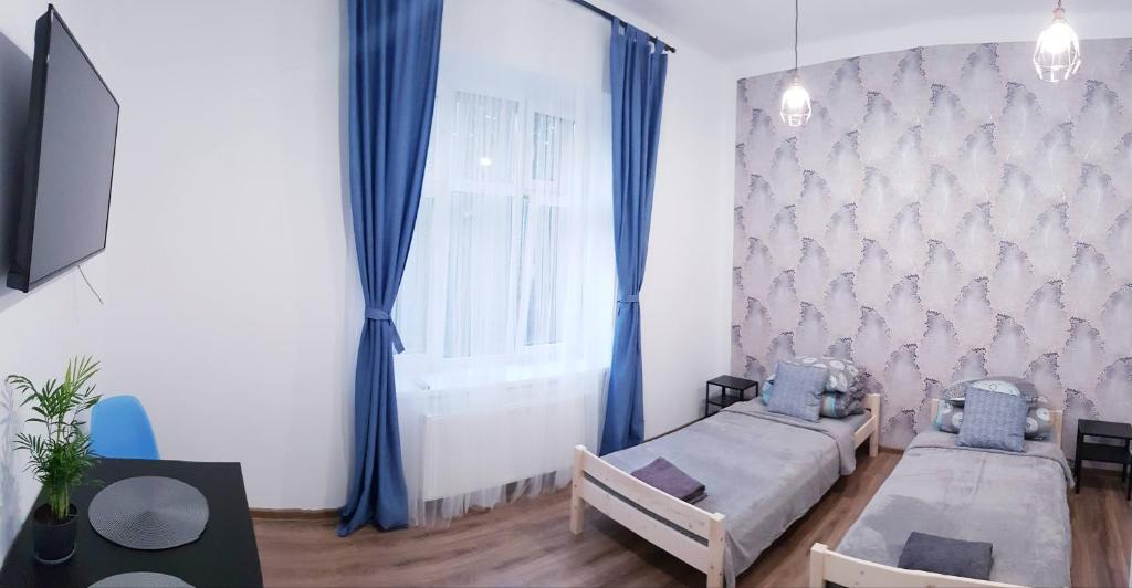 Двухместный (Просторный двухместный номер с 2 отдельными кроватями) семейного отеля Guest Room RÓWNA, Кельце