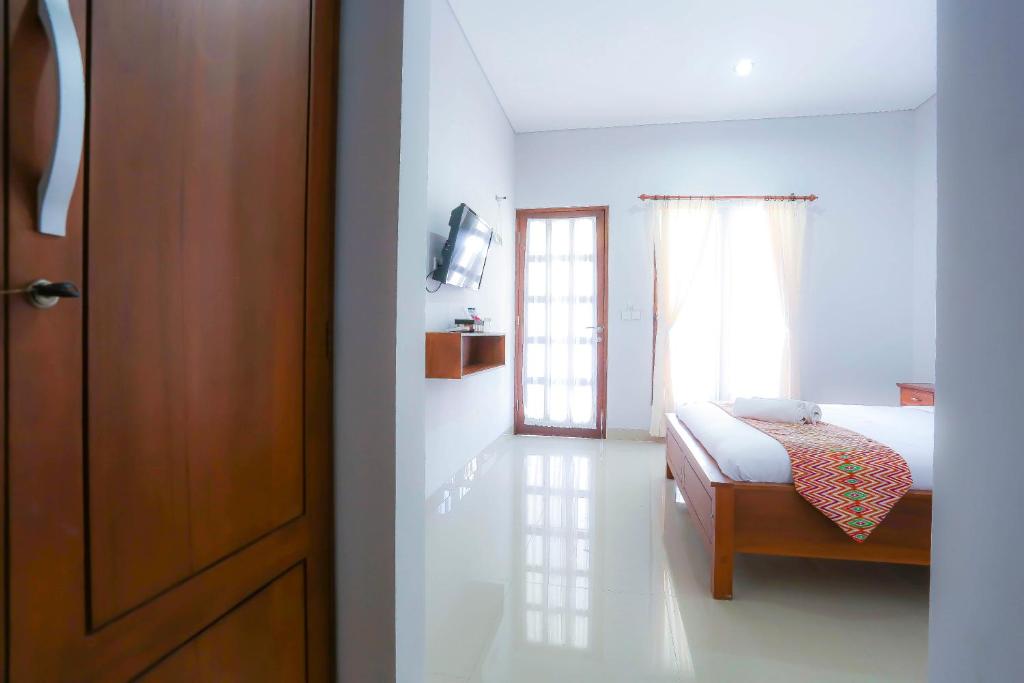 Двухместный (Двухместный номер Делюкс с 1 кроватью или 2 отдельными кроватями) семейного отеля D'padang, Улувату