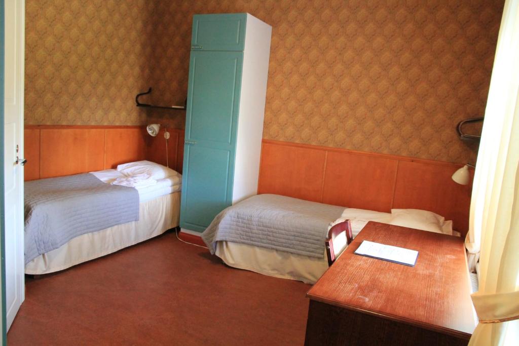 Двухместный (Двухместный номер с 2 отдельными кроватями) хостела Savonlinnan Kristillinen Opisto - Wanha Pappila, Савонлинна