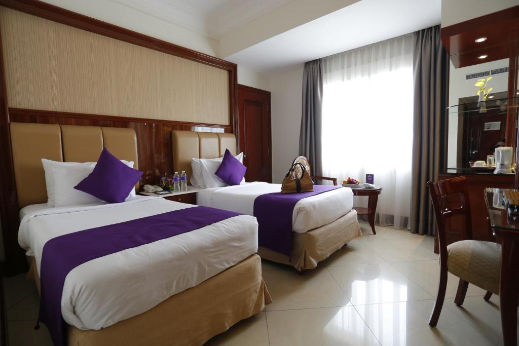 Двухместный (Улучшенный двухместный номер с 2 отдельными кроватями) отеля Park Regis Arion Kemang, Джакарта