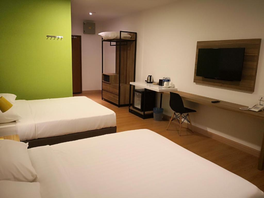 Двухместный (Клубный двухместный номер Делюкс с 2 отдельными кроватями) курортного отеля Aman Tioman Beach Resort, Тиоман