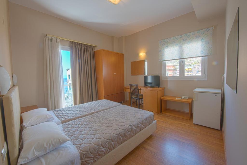 Двухместный (Улучшенный двухместный номер с 1 кроватью или 2 отдельными кроватями) отеля Grand Olympic Hotel Loutraki, Лоутраки