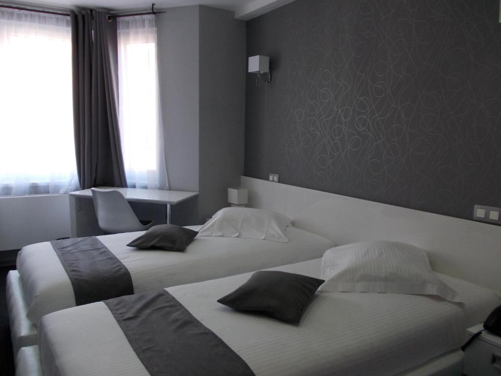 Двухместный (Бюджетный двухместный номер с 2 отдельными кроватями) отеля Hotel Phenix, Брюссель