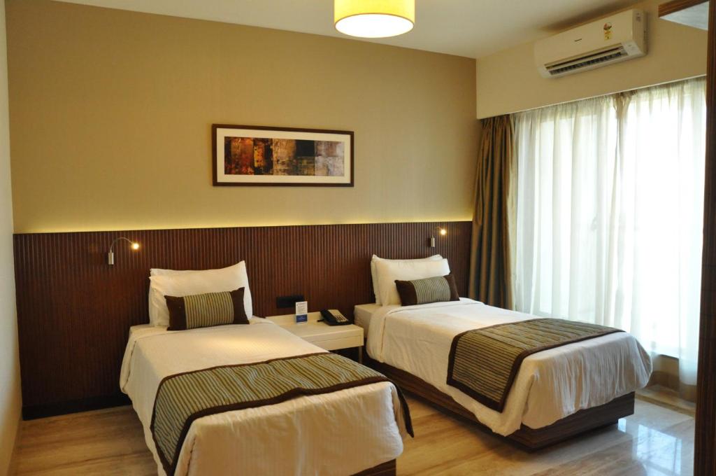 Двухместный (Улучшенный двухместный номер с 1 кроватью или 2 отдельными кроватями) отеля Residency Sarovar Portico, Мумбай