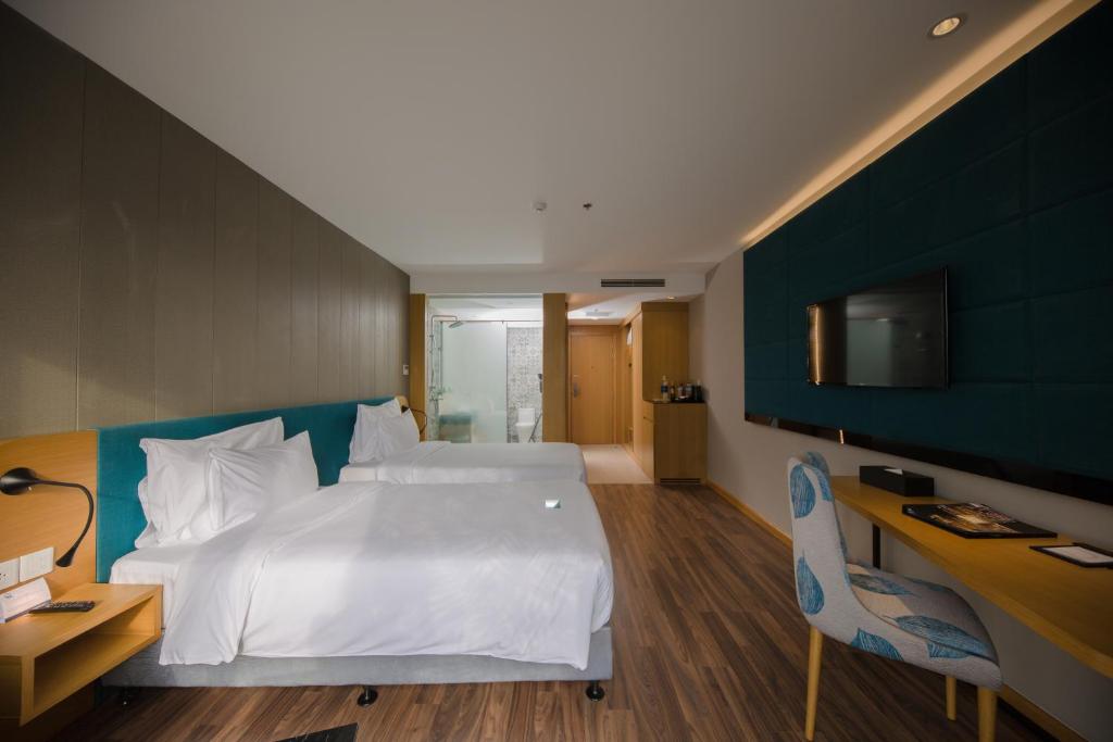 Двухместный (Двухместный номер Делюкс с 2 отдельными кроватями) отеля Quinter Central Nha Trang, Нячанг