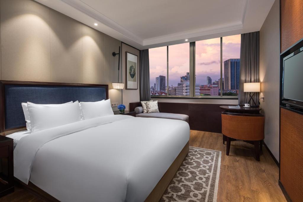 Двухместный (Номер Делюкс с кроватью размера “queen-size” - Для некурящих) отеля Yiwu Kasion Purey Hotel, Иу