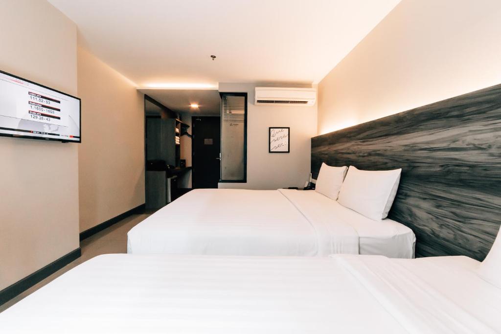 Трехместный (Современный номер Делюкс с дополнительной кроватью) отеля Spenza, Бангкок