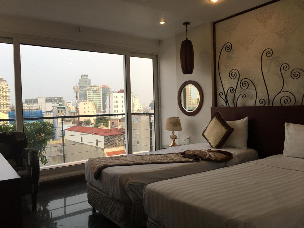Двухместный (Двухместный номер Делюкс с 2 отдельными кроватями) отеля Icon 36 Hotel - Hang Bong, Ханой