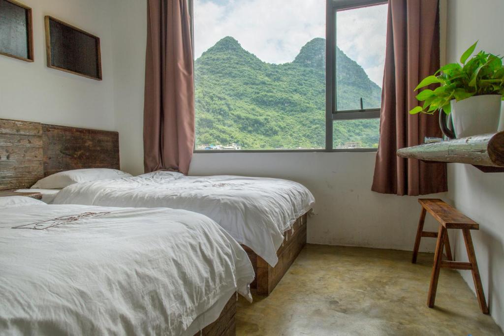 Двухместный (Стандартный двухместный номер с 2 отдельными кроватями без балкона) хостела Mountain Stream Inn Yangshuo, Яншо