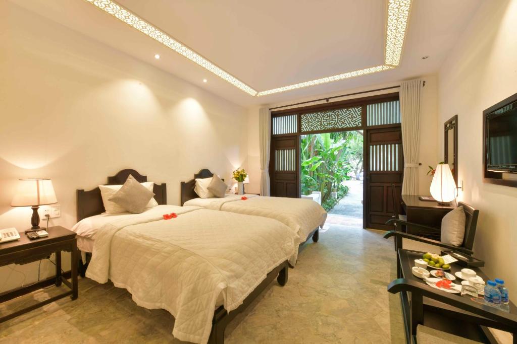 Двухместный (Двухместный номер с 1 кроватью или 2 отдельными кроватями, вид на сад) курортного отеля Hoi An Ancient House Resort & Spa, Хойан