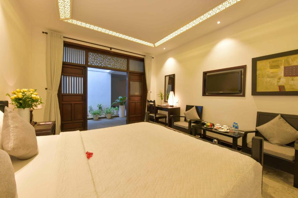 Двухместный (Улучшенный двухместный номер с 1 кроватью или 2 отдельными кроватями) курортного отеля Hoi An Ancient House Resort & Spa, Хойан