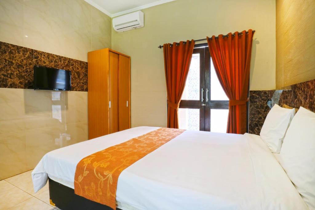 Двухместный (Улучшенный двухместный номер с 1 кроватью или 2 отдельными кроватями) гостевого дома Lembayung Sari Homestay, Денпасар