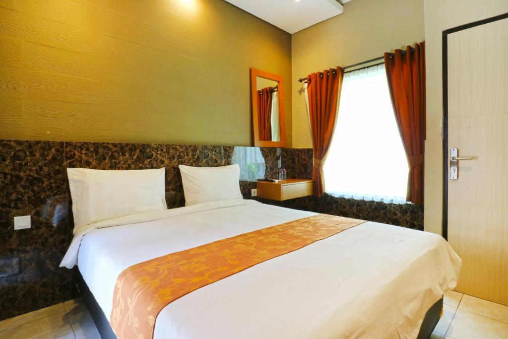Двухместный (Улучшенный двухместный номер с 1 кроватью) гостевого дома Lembayung Sari Homestay, Денпасар