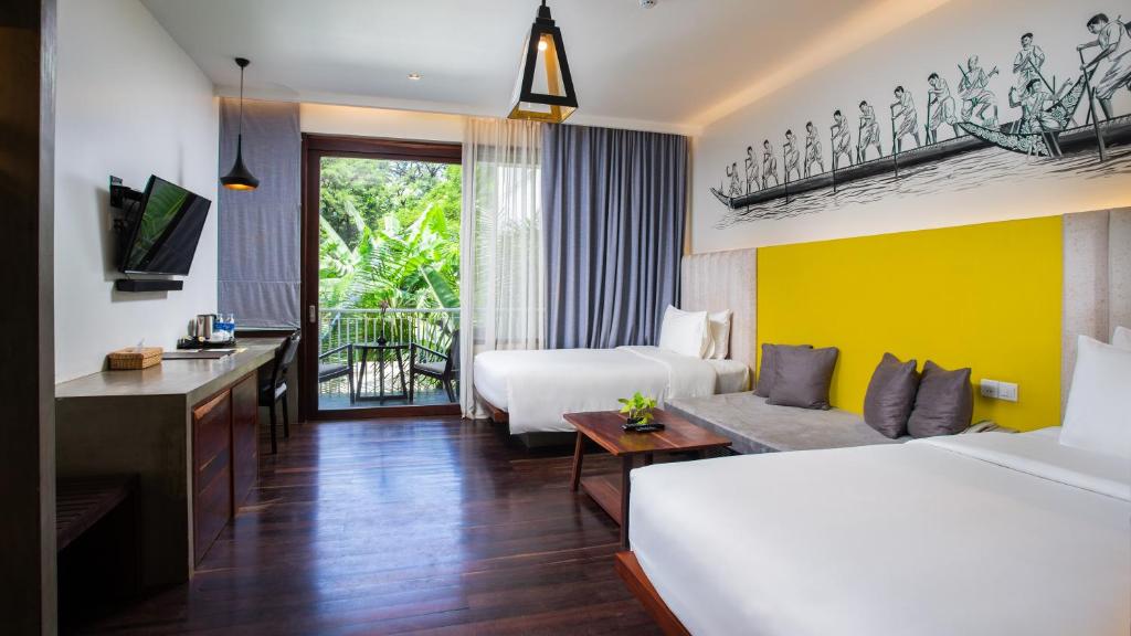 Двухместный (Двухместный номер Делюкс с 2 отдельными кроватями и балконом — Бесплатный трансфер до отеля) отеля Apsara Residence Hotel, Сием Рип