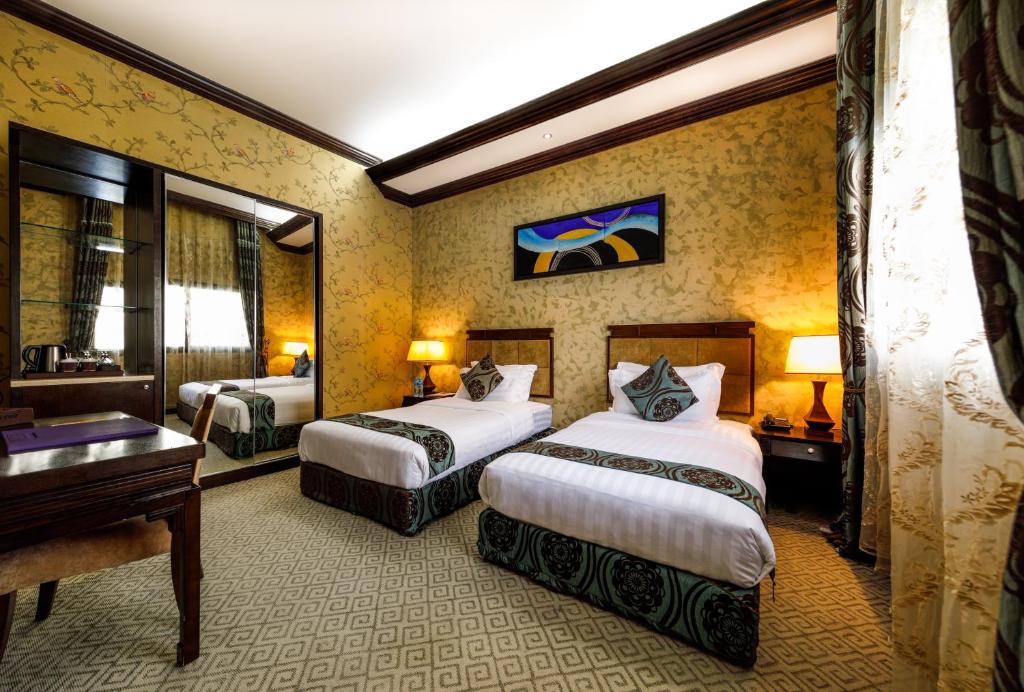 Двухместный (Двухместный номер Делюкс с 1 кроватью или 2 отдельными кроватями, бесплатные билеты в зоопарк «Эмираты» и скидка 25% на еду и напитки и спа-ус�) курортного отеля Emirates Park Resort, Аль-Раба