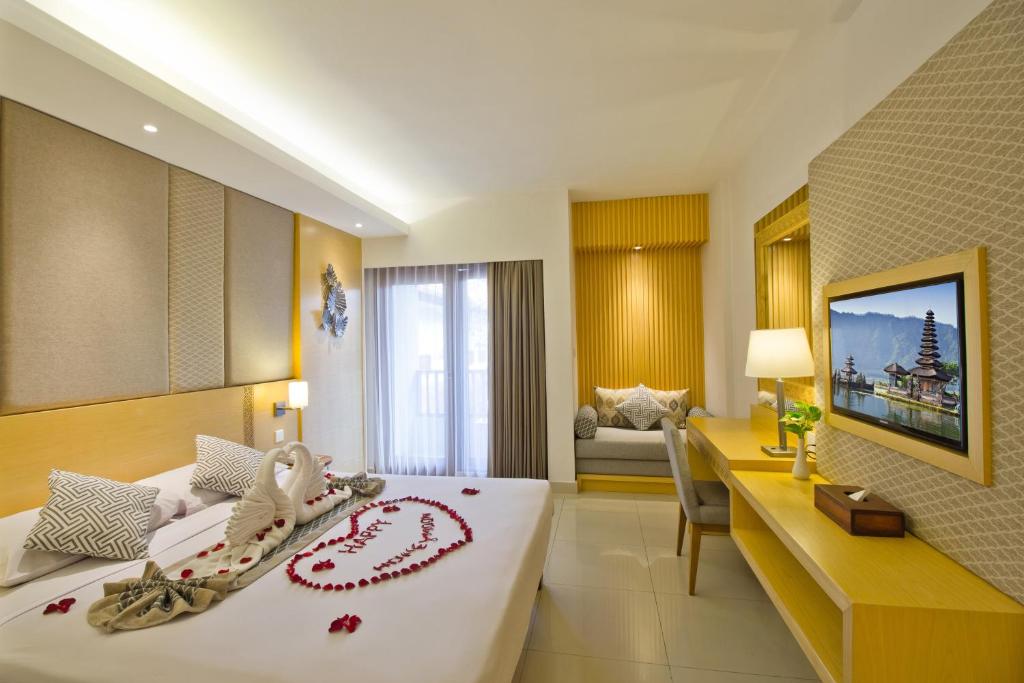 Двухместный (Улучшенный двухместный номер с 1 кроватью или 2 отдельными кроватями) отеля Bali Rani Hotel, Кута